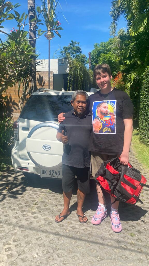 Komang with his friend and guest