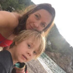 Woman with a boy on a beach